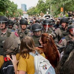 Texas state troopers with protesters at the University of Texas at Austin on Wednesday.