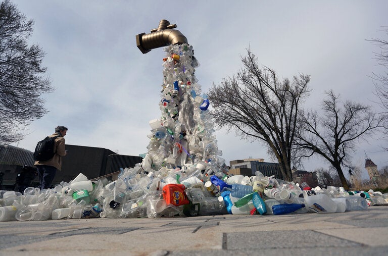 A sculpture titled “Giant Plastic Tap,” by the Canadian artist Benjamin Von Wong, outside the fourth session of the U.N. Intergovernmental Negotiating Committee on Plastic Pollution in Ottawa on Tuesday.
