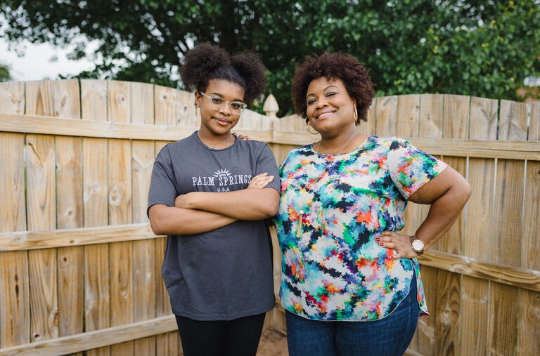 Keeva Haynes, right, with her daughter, Jaida, in the backyard of their new home outside Atlanta. With a budget of $450,000, Ms. Haynes hoped to find a place with separate working and living spaces, in the right school zone.