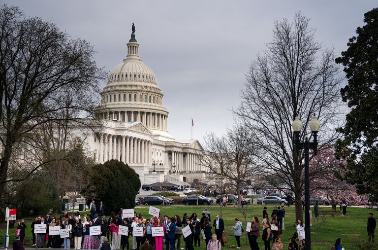 Supporters of TikTok gather along Independence Ave in view of the dome of the U.S. Capitol in Washington D.C.