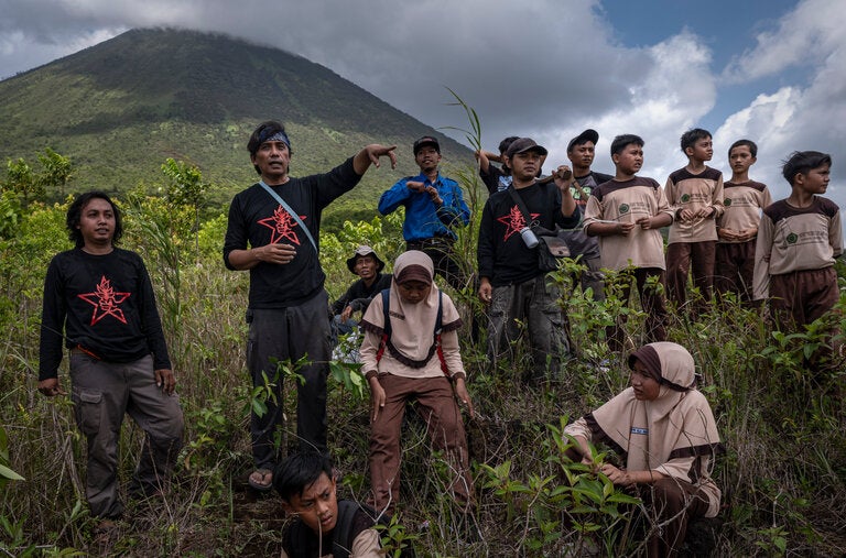 Aak Abdullah al-Kudus and his Green Army volunteers plant trees in Indonesia.