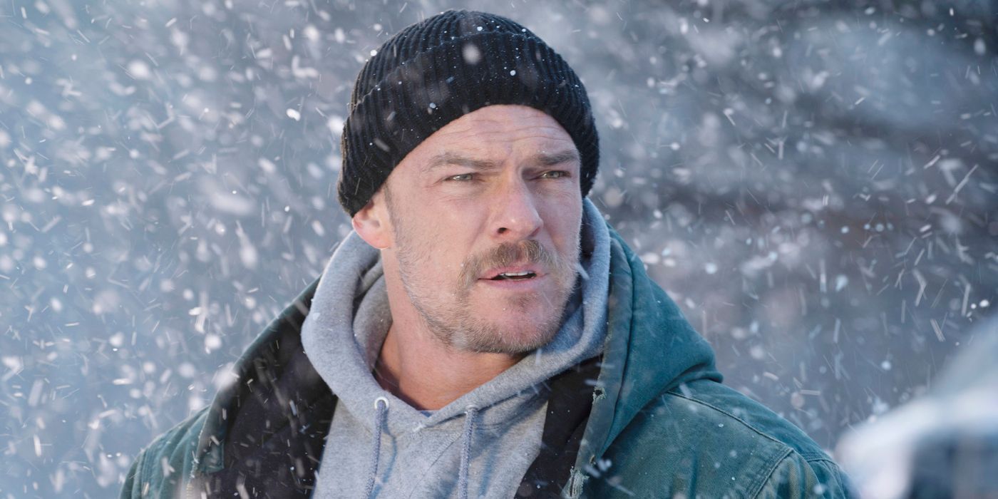 Alan Ritchson in the snow in Ordinary Angels