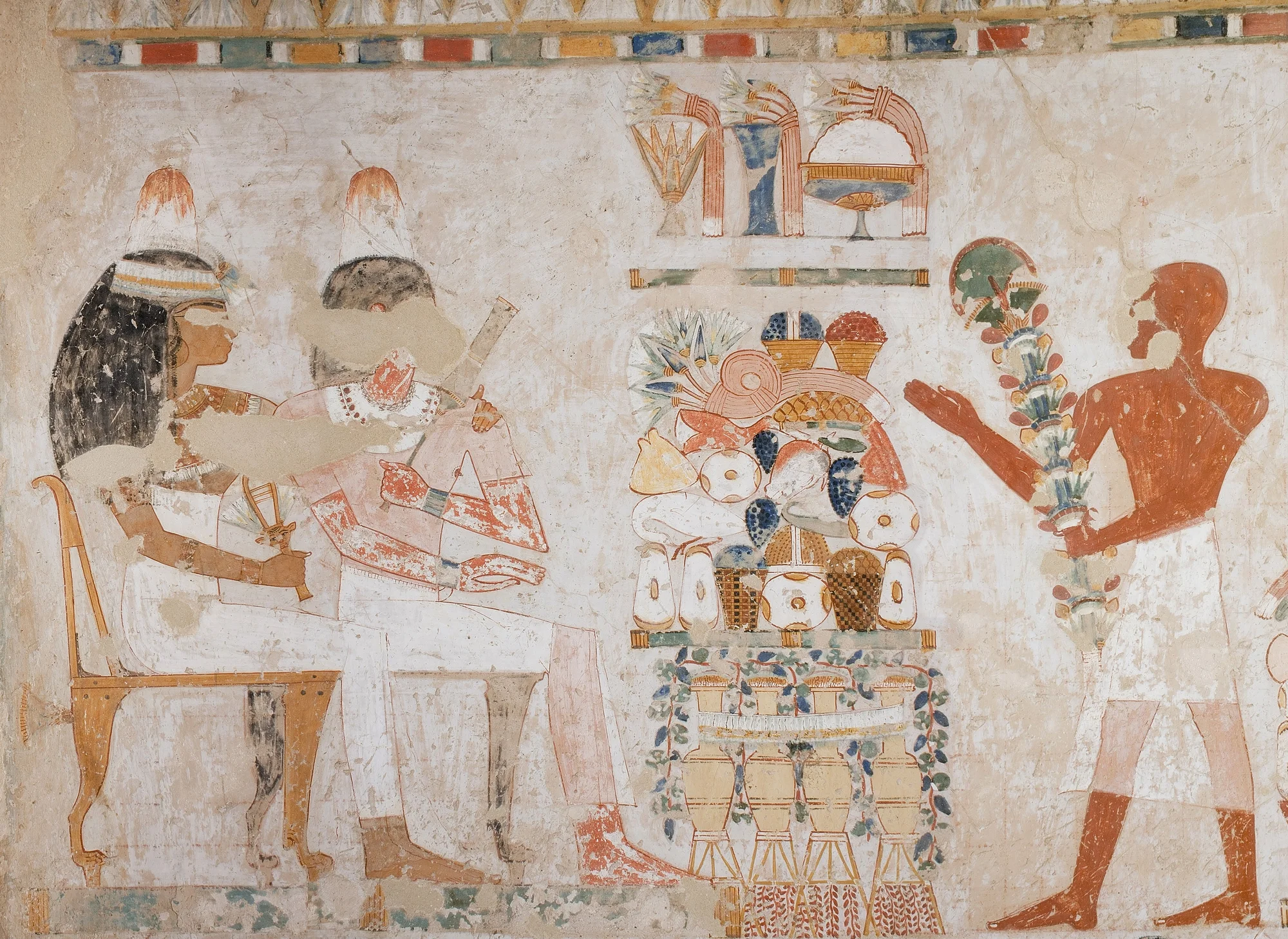Ancient Egyptian painting depicting people presenting offerings of food and drink to deities.