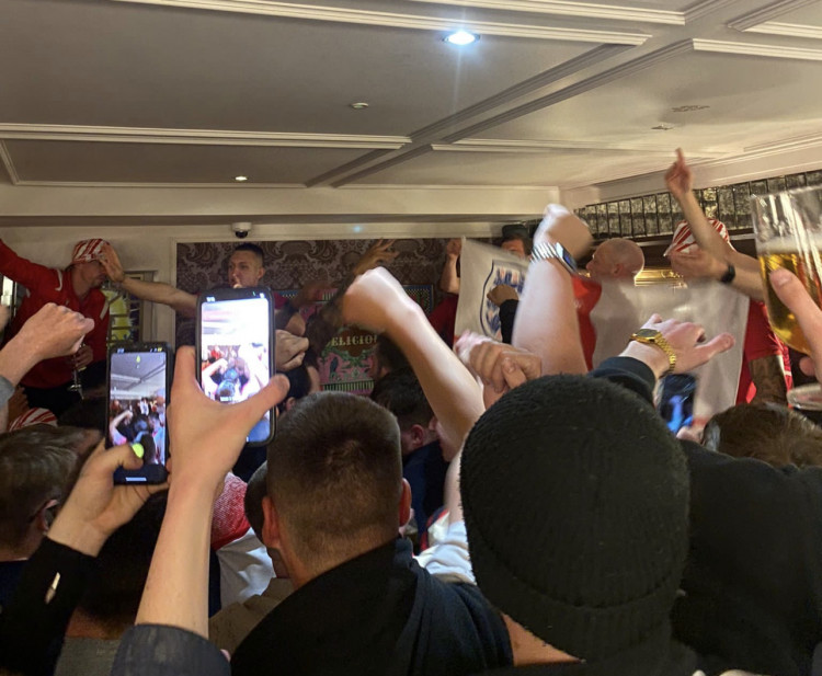 The Perfect Day: Stevenage fan Owen Rodbard relives Boro's promotion party. PICTURE: Fans and players celebrate Boro's promotion in the Cromwell. 