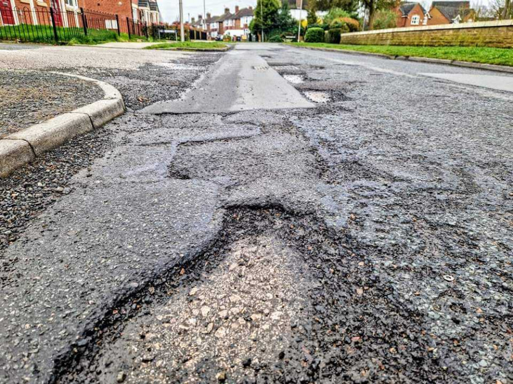 The state of the road on Salisbury Avenue, Crewe. According to FixMyStreet, there are 476 reports of potholes within the CW1 postcode (Ryan Parker).