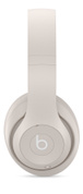 Side view of Beats Studio Pro Wireless Headphones in Sandstone, showing distinctive Beats logo.