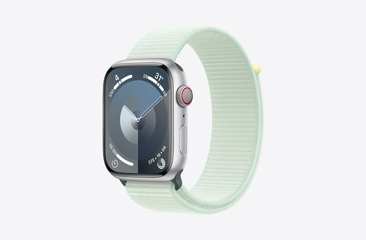 Apple Watch with Silver Aluminium case with matt finish and angled view of Soft Mint (green) Sport Loop, featuring a hook-and-loop fastener and double-layer nylon weave