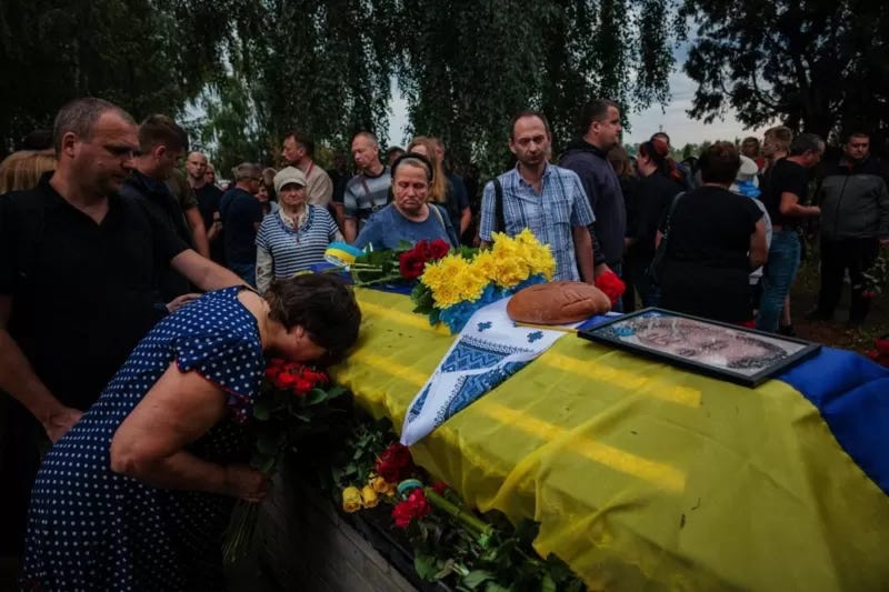 Funeral of a Ukrainian soldier at the cemetery in Bucha, Kiev district, August 13. © AFP via Getty