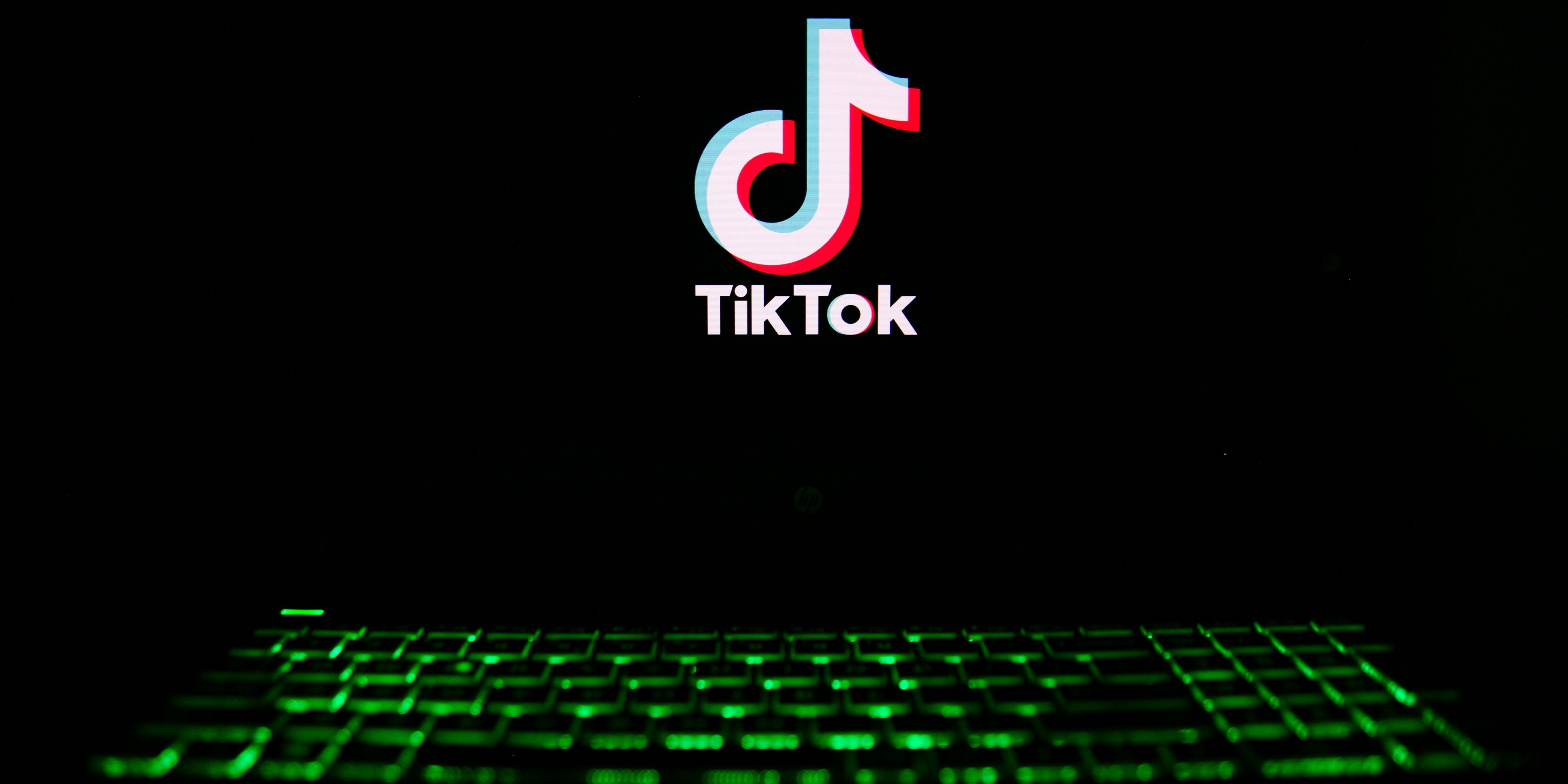 The TikTok logo is being displayed on a laptop screen with a glowing keyboard in Krakow, Poland, on March 3, 2024. (Photo by Klaudia Radecka/NurPhoto via Getty Images)