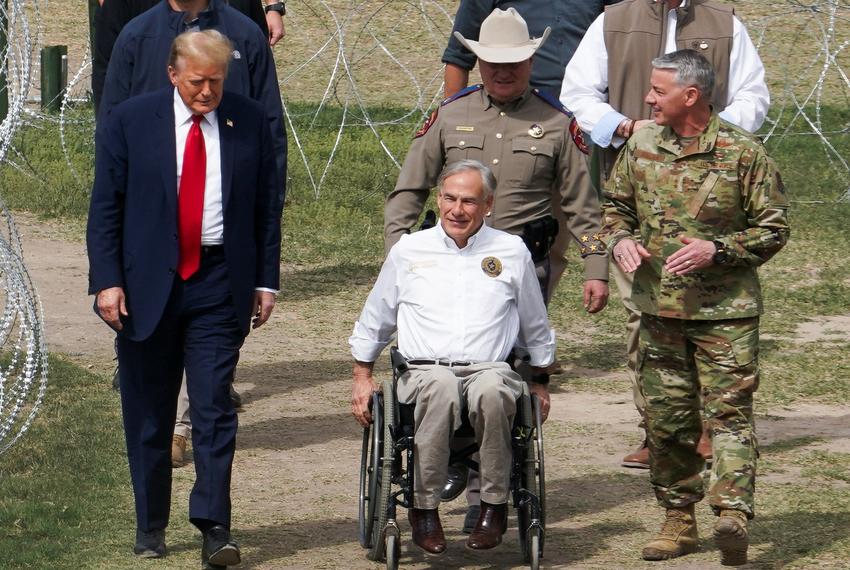 Republican presidential candidate and former U.S. President Donald Trump walks next to Texas Governor Greg Abbott as Trump visits the U.S.-Mexico border in Eagle Pass, TX on Feb. 29, 2024.