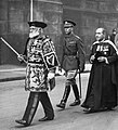 George VI preceded by the Herald, Lord Lyon King of Arms