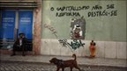 Man and dog by griffiti in Lisbon