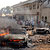 A car burns at the scene of a bomb explosion at St. Theresa Catholic Church at Madalla, Suleja, just outside Nigeria's capital Abuja, December 25, 2011