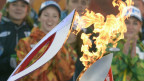 Зажжение олимпийского факела "Сочи-2014" от огня из Олимпии по прибытию его в Москву