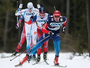 8 January 2015: (R-L) Evgeniy Belov of Russia competes ahead of Martin Johnsrud Sundby of Norway, and Calle Halfvarsson of Sweden during the men's FIS Tour de ski cross-country skiing 25km free pursuit race in Toblach