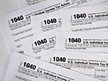 File: U.S. Department of the Treasury Internal Revenue Service 1040 forms from the 2011 tax year.