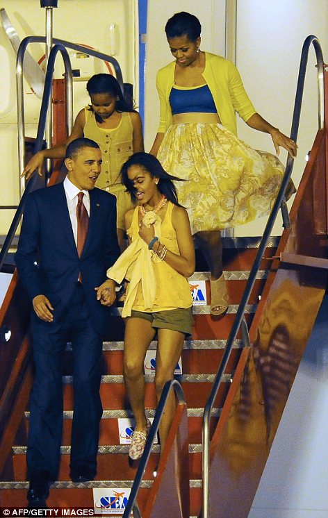 Trip: As the fire rained down on Libya, President Barack Obama was in Brazil with First Lady Michelle and daughters Malia, right, and Sasha, left, at the start of a five-day Latin America tour