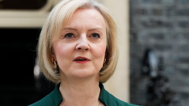 FILE - Outgoing British Prime Minister Liz Truss speaks outside Downing Street in London, on Oct. 25, 2022. Truss will join the former leaders of Australia and Belgium at a conference in Tokyo later Feb. 2023 to call for a tougher international approach to China. (AP Photo/Frank Augstein, File)