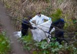 Article thumbnail: Police and forensic officers at Kersal Dale, near Salford, Greater Manchester, where a major investigation has been launched after human remains were found on Thursday evening. Greater Manchester Police (GMP) said officers were called by a member of the public who found an "unknown item wrapped in plastic". Picture date: Friday April 5, 2024. PA Photo. The remains, which are yet to be identified, were found in a secluded woodland area where an extensive police scene has been put in place See PA story POLICE Salford. Photo credit should read: Peter Byrne/PA Wire