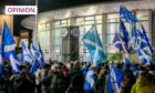 photo shows a large crowd of independence supporters waving saltires outside Perth Concert Hall.