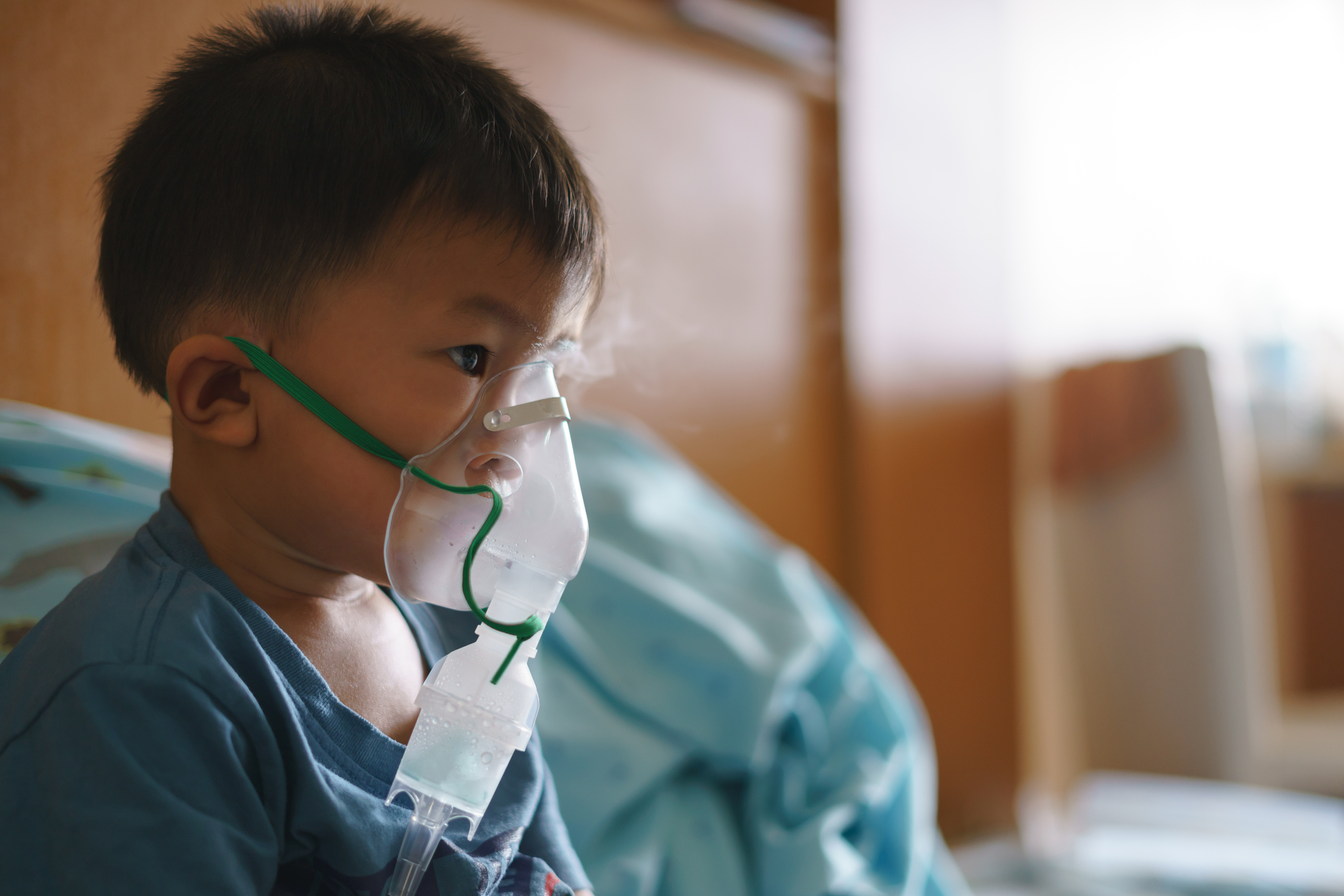 Boy using inhaler