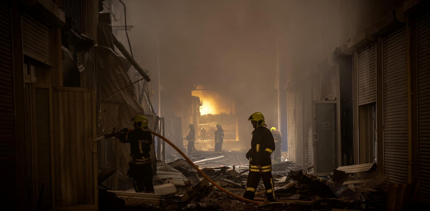 Firefighters work at a site of storage facilities hit during Russian missile and drone strikes, amid Russia's attack on Ukraine, in Odesa.