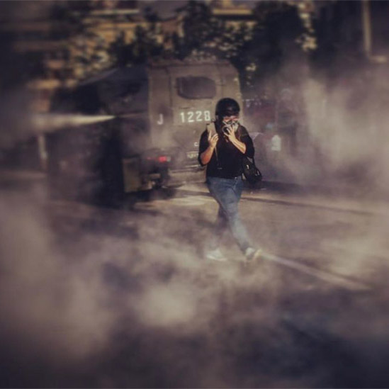 Chilean police using armoured vehicles to disperce protesters.