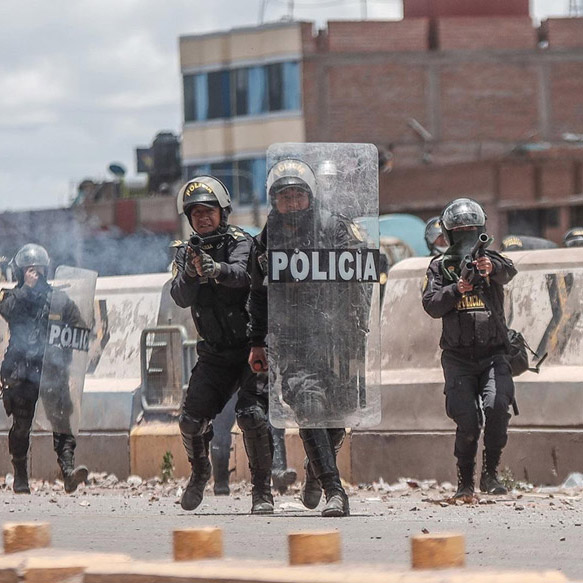 Police firing tear gas during anti-government protests in Lima.