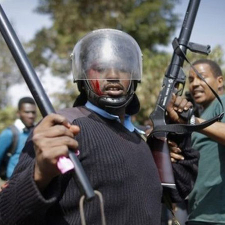 Tear gas used on children protesting playground closure.