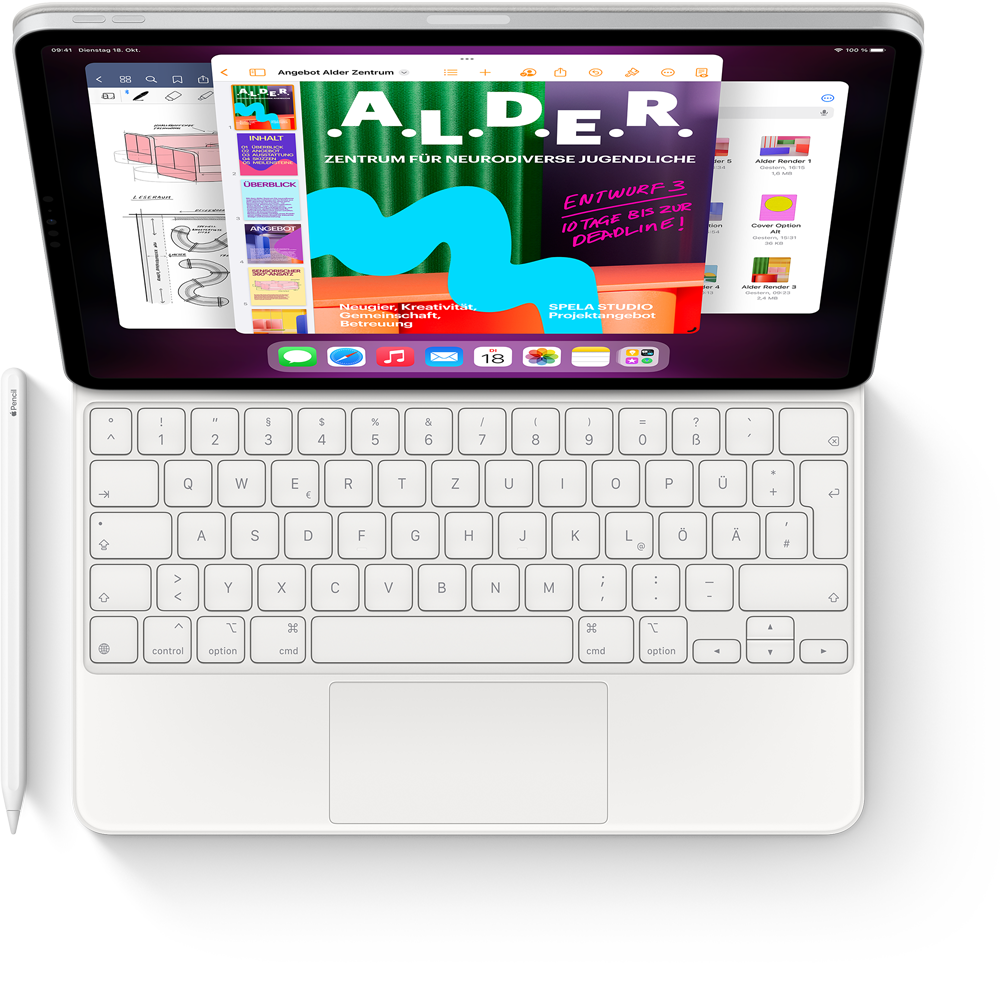 Blick von oben auf ein iPad Pro mit Magic Keyboard und Apple Pencil, das den Stage Manager mit mehreren geöffneten Apps anzeigt.