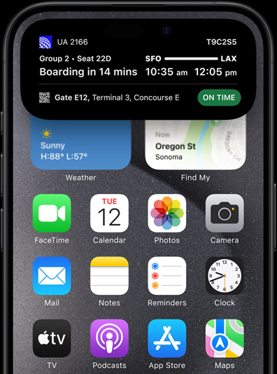 iPhone 15 Pro with Dynamic Island showing live sports scores