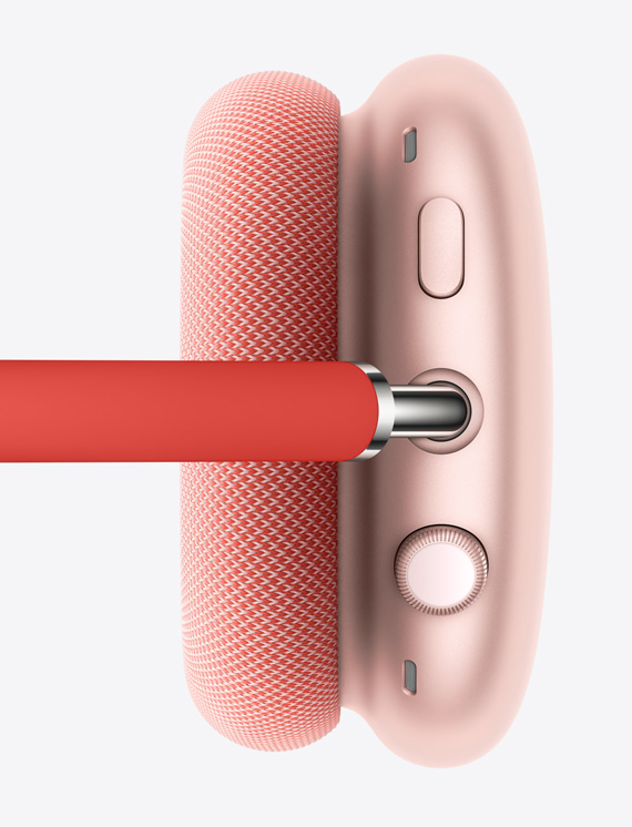 Зображення коронки Digital Crown і кнопки поглинання шуму на правому навушнику рожевого кольору.