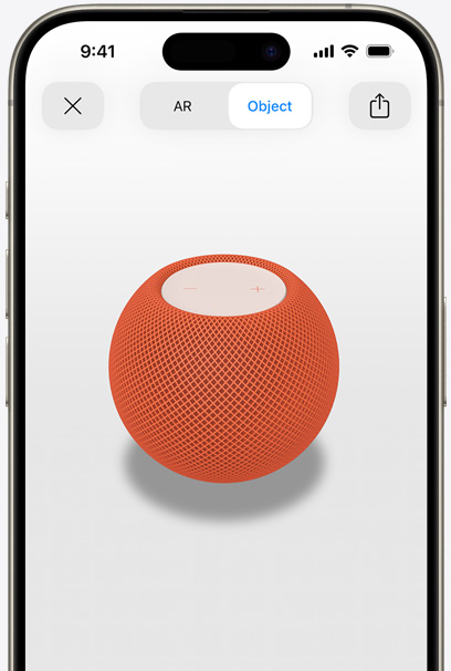 En HomePod i farven orange vises i AR på en iPhone-skærm.