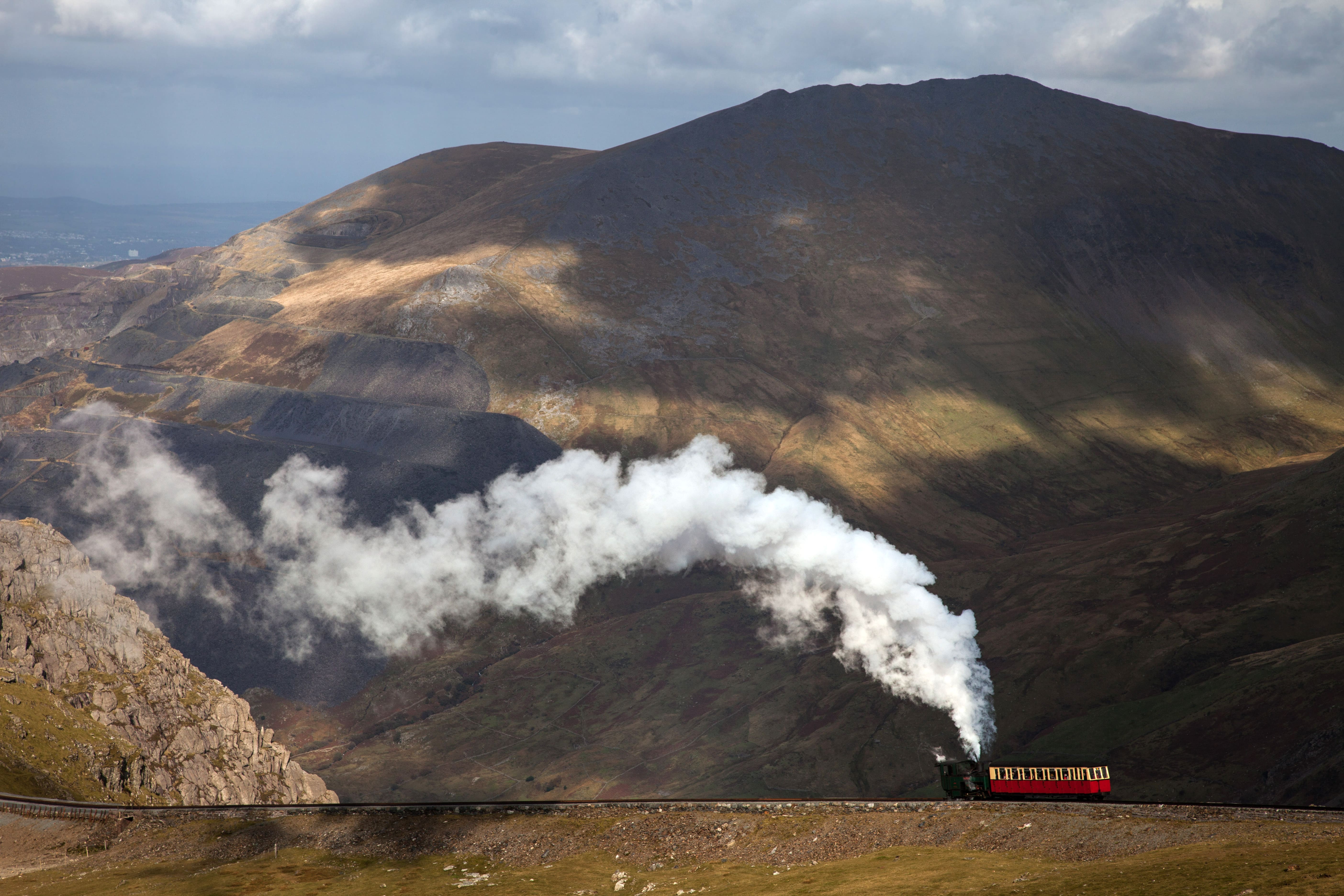 The narrow-gauge passenger railway to the top of Snowdon, with a steam locomotive and carriage