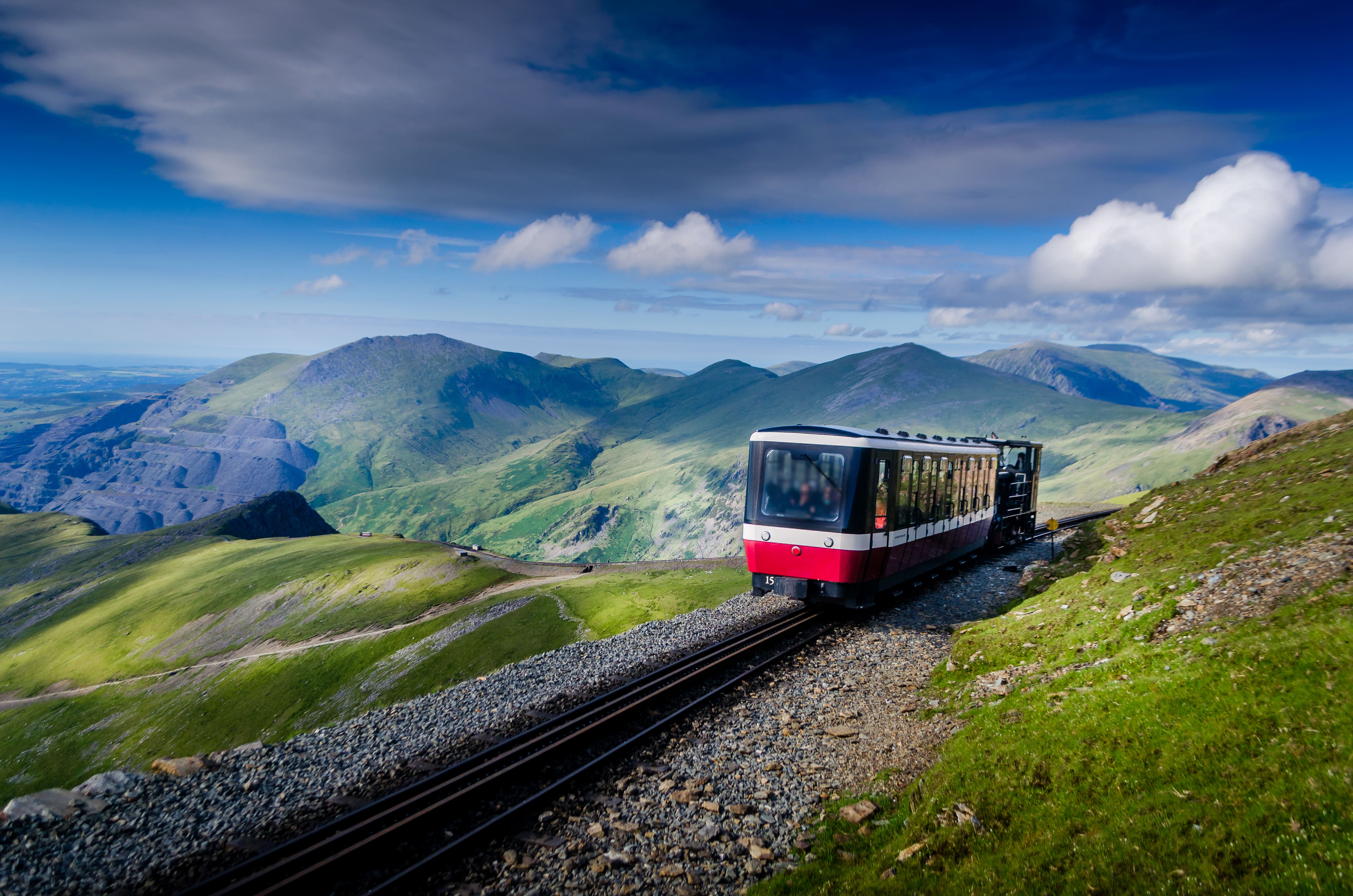 A small train travelling up to the summit of Mount Snowdon
