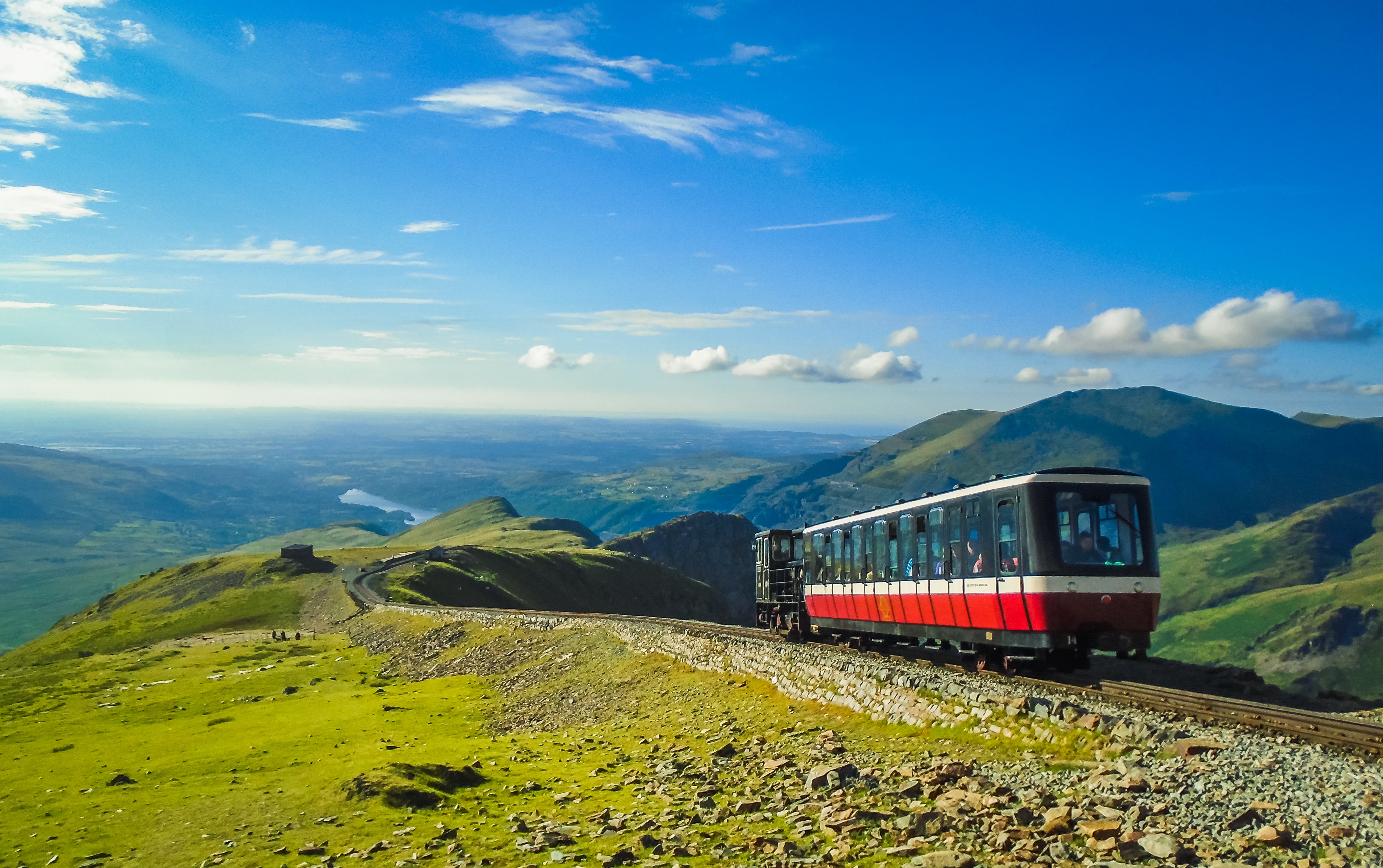 A small train journeying from the Snowdon summit on the llanberis path
