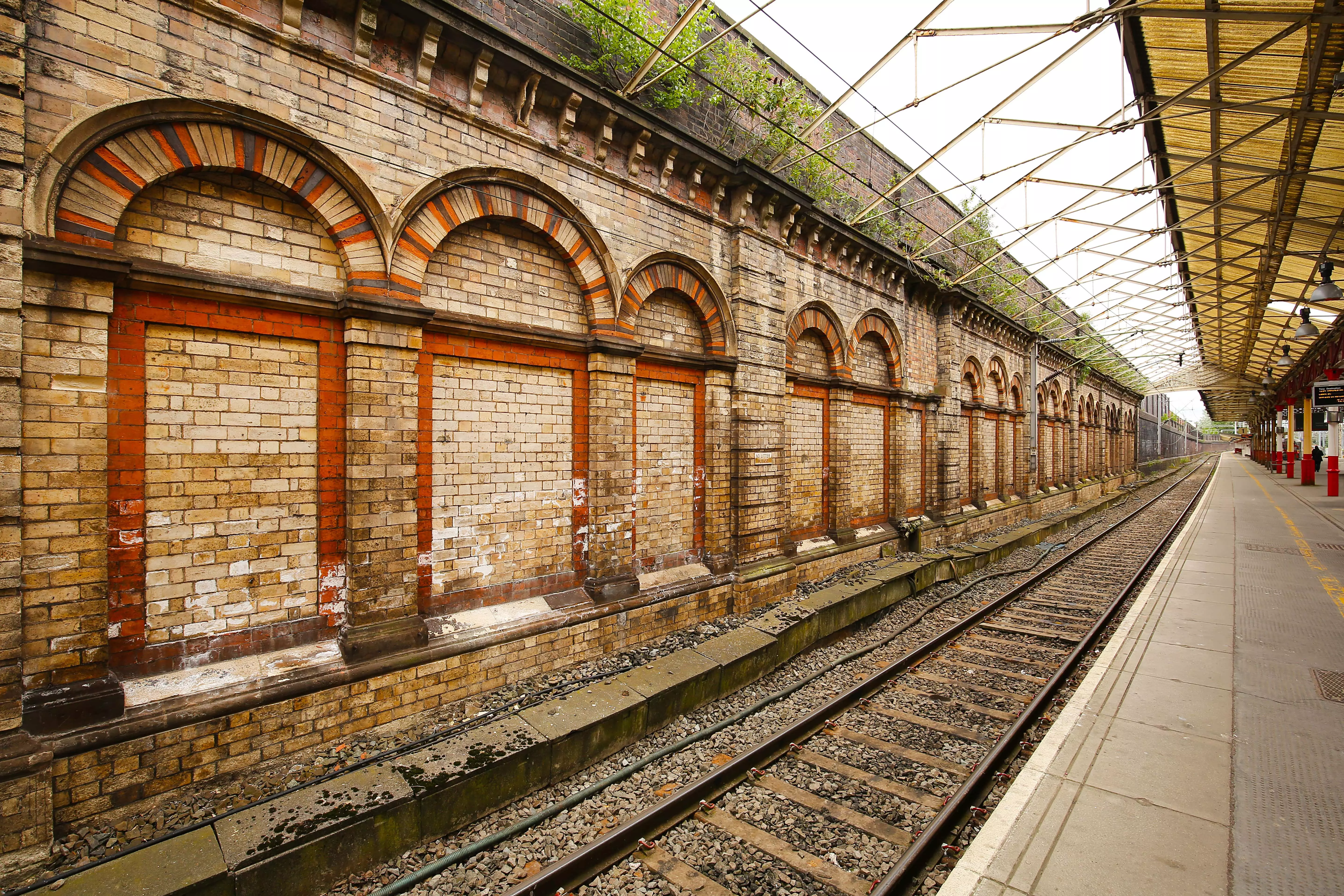 Railway station in Crewe, one of the most historic railway stations in the world with 19th century brick work and arches.