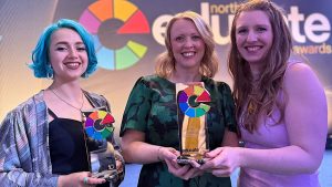 Ecaterina Stefanescu (Lecturer in Architecture), Louise Finch (Senior Internal Communications Officer) and Helen O’Rourke (Wellbeing Advisor) with the University of Central Lancashire’s two awards. Pic: UCLan