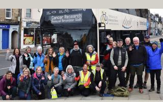 All aboard! Walkers prepare to board the bus in Selkirk's Market Place on Sunday morning. Photo: John Smail