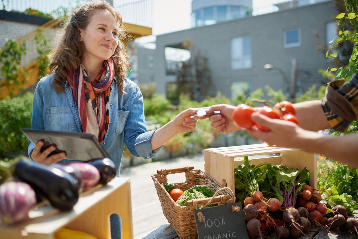 Lady walking through a farmer's market