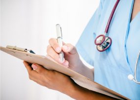 Photo of doctor with clipboard