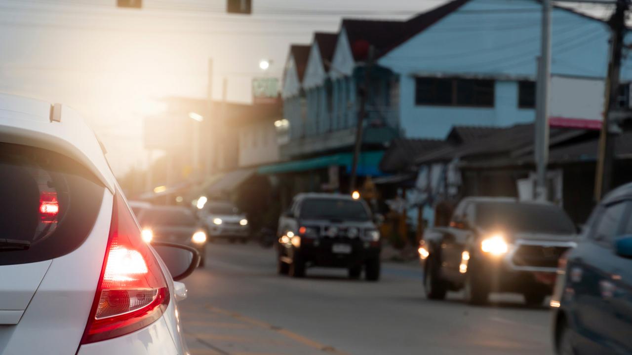 A car driving through a downtown street