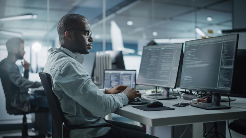 A male sitting a desk