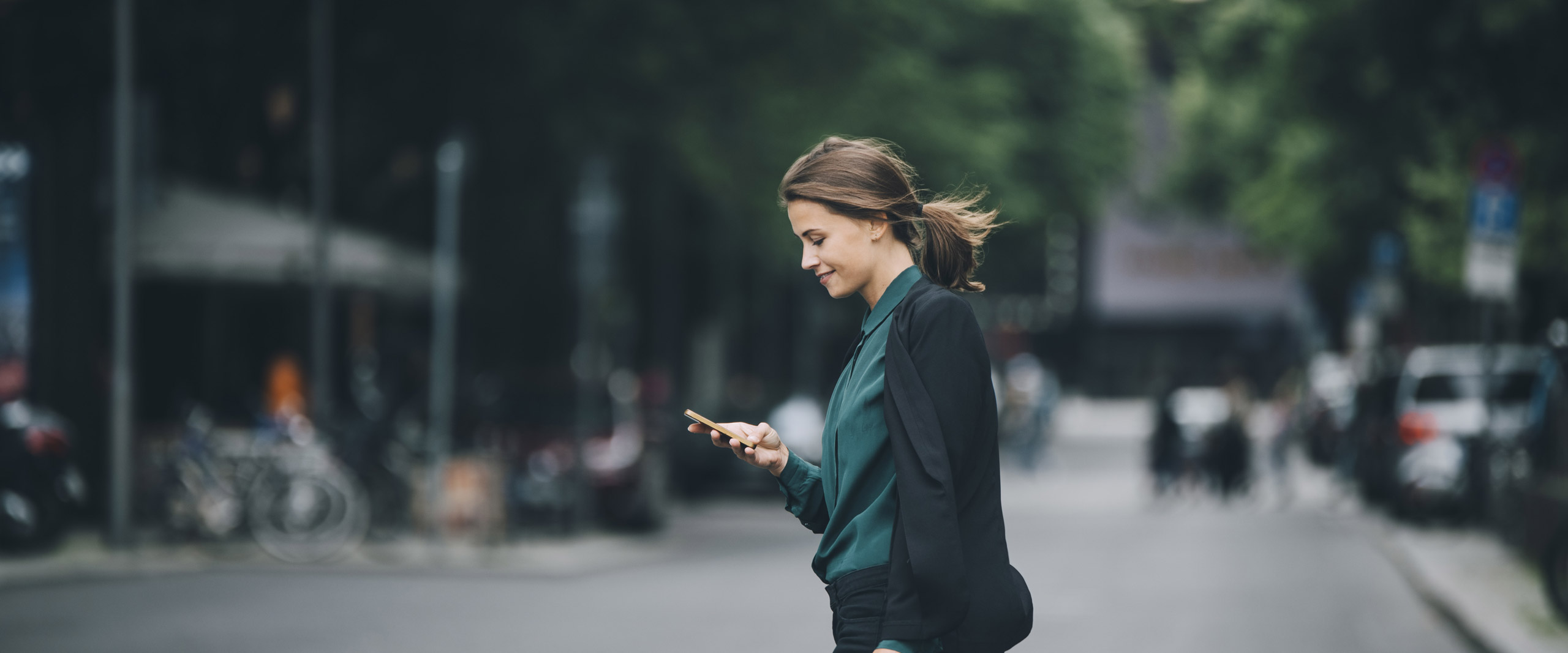 Real estate agent looking at phone