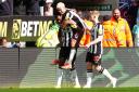 Alexander Isak, left, celebrates his second goal against Sheffield United with team-mates Bruno Guimaraes and Anthony Gordon (Owen Humphreys/PA)