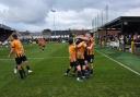 Talbot's players celebrate the first of their four goals on Saturday