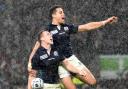 Mark Bennet celebrates with Sean Maitland after scoring at the World Cup.