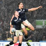 Mark Bennet celebrates with Sean Maitland after scoring at the World Cup.