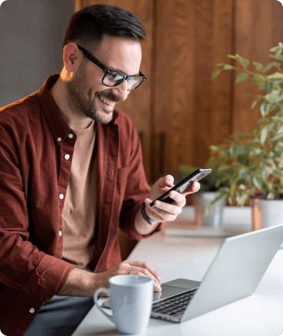 Man with laptop and smartphone