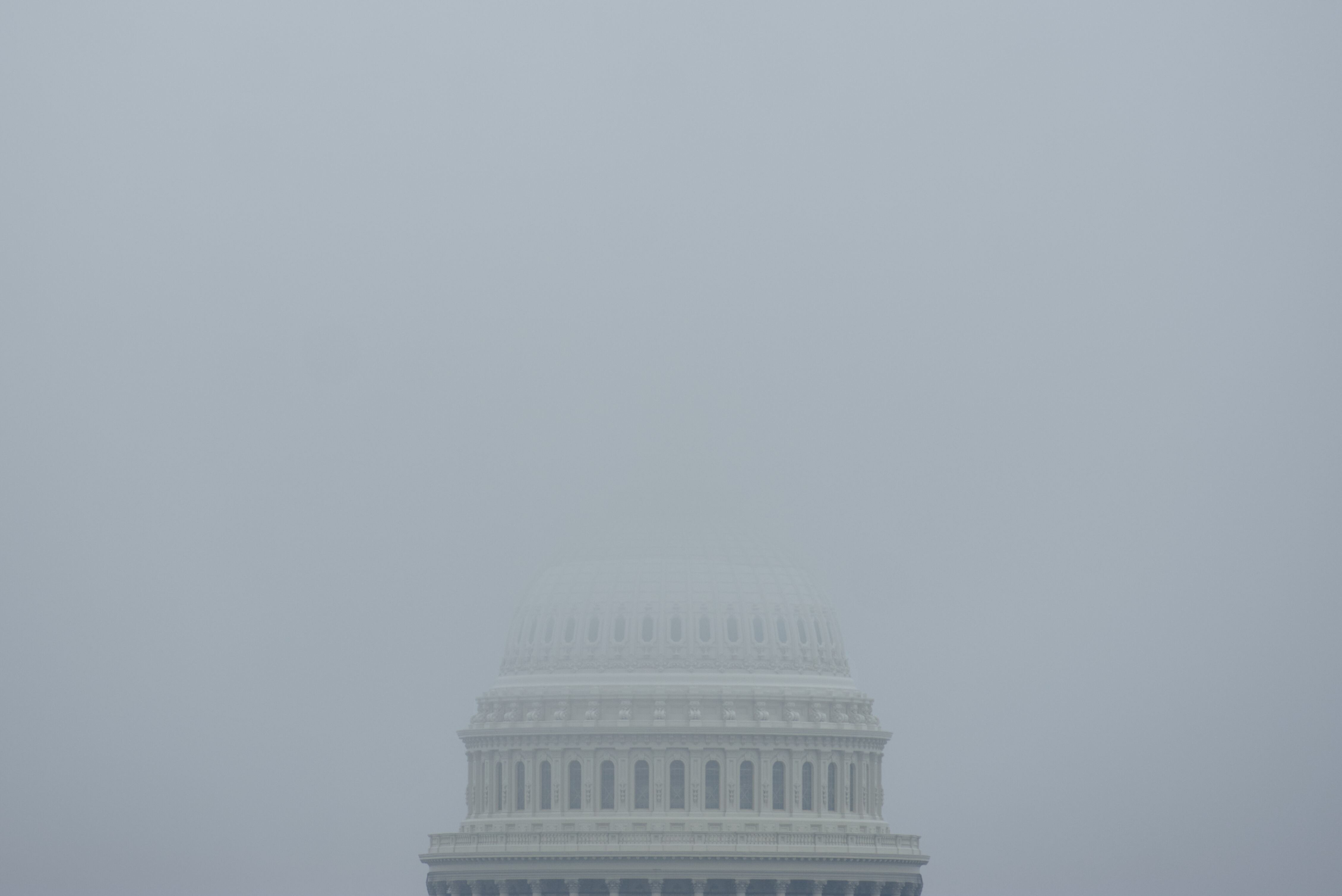 The top of the Capitol Dome in Washington, D.C., is obscured by fog Dec. 3, 2023.